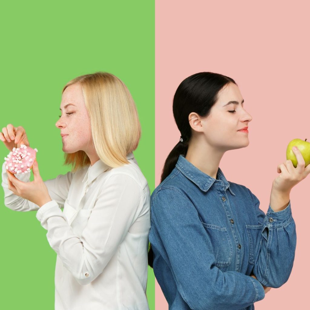 Two women choosing between healthy and unhealthy food options